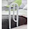 Height-adjustable bedside rail for standing assistance