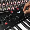 M-Audio Oxygen Pro 49 MIDI keyboard controller — 49 keys, 16 pads, 9 faders, OLED display, USB, MIDI out