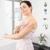 Handheld rolling massager Medisana AC 950 — cordless Li‑Ion, 2 power levels, ergonomic handles, 381 g, rose gold/white