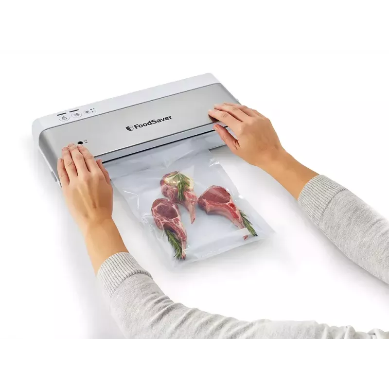 Vacuum sealer FoodSaver VS0100X — rotary control, includes roll and 4 vacuum bags, silver-white