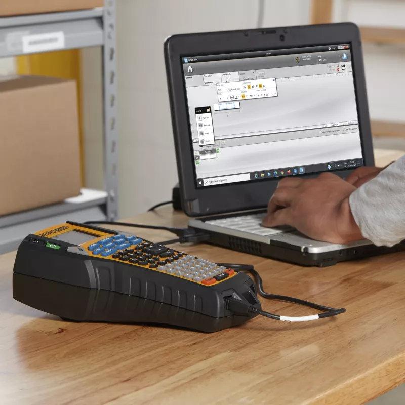 DYMO Rhino 6000+ Industrial Label Maker | Computer Connected Label Maker with Hard Carry Case | Includes 1 Vinyl Tape Cassette1 Flexible Nylon Tape Cassette and Rechargeable Lithium Ion Battery