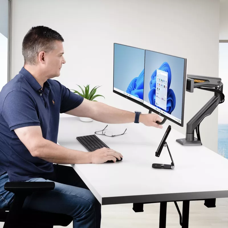 StarTech.com Desk Mount Dual Monitor Arm with Crossbar, Up To 27 inch Displays, VESA 75x75/100x100, Max 33lb/15kg, C-Clamp, Fully Articulating, Mechanical Spring, TAA