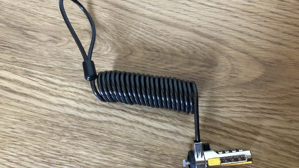 Coiled steel security cable with a Kensington laptop lock head