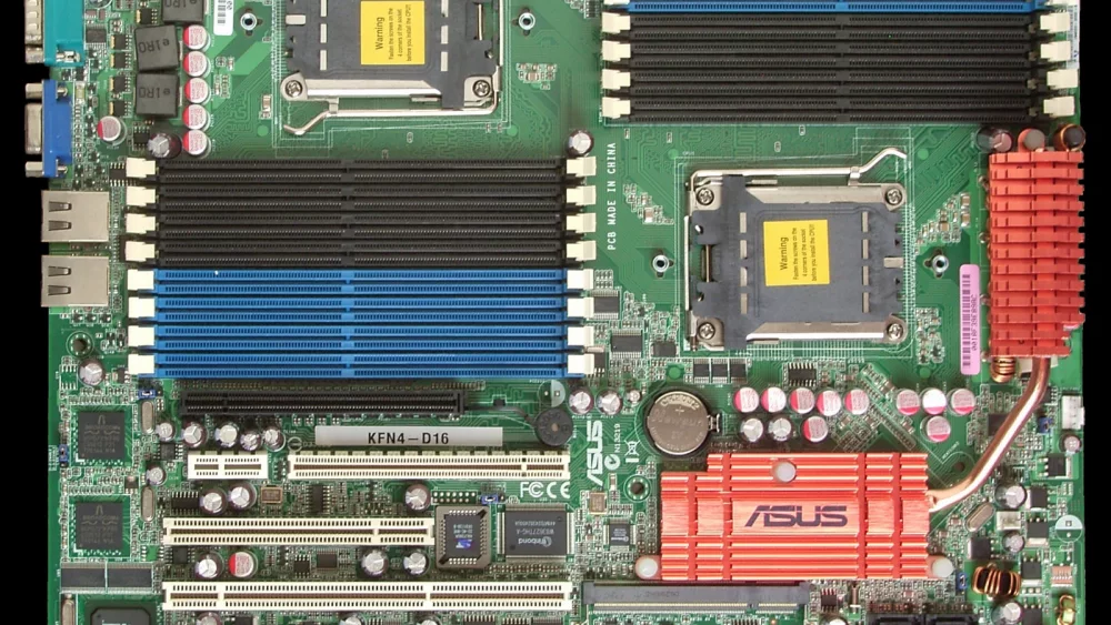 Dual-socket workstation motherboard with memory slots and PCIe slots