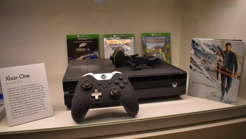 Xbox console and controller in a display case